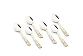 Set of six stainless steel baby spoons with ornate silver-gold patterned handles on white background.